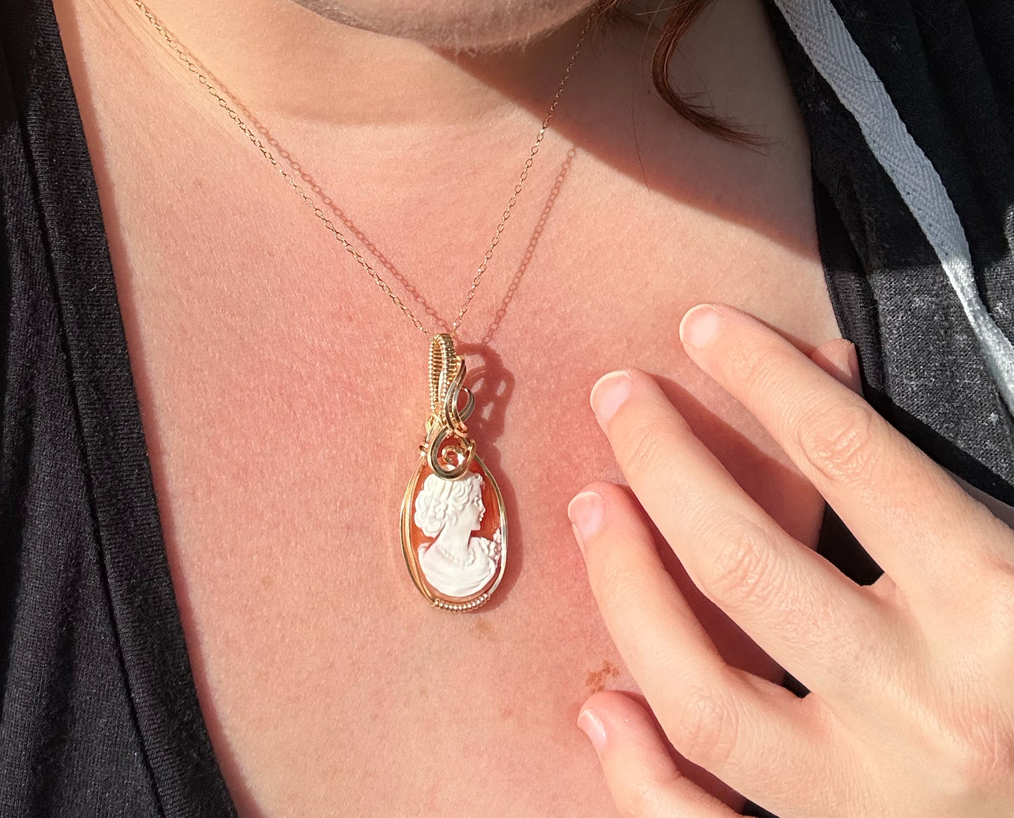 Wire wrapped 14k goldfilled wire pendant of a handcarved shell vintage cameo of a woman with a pearl necklace and flowers