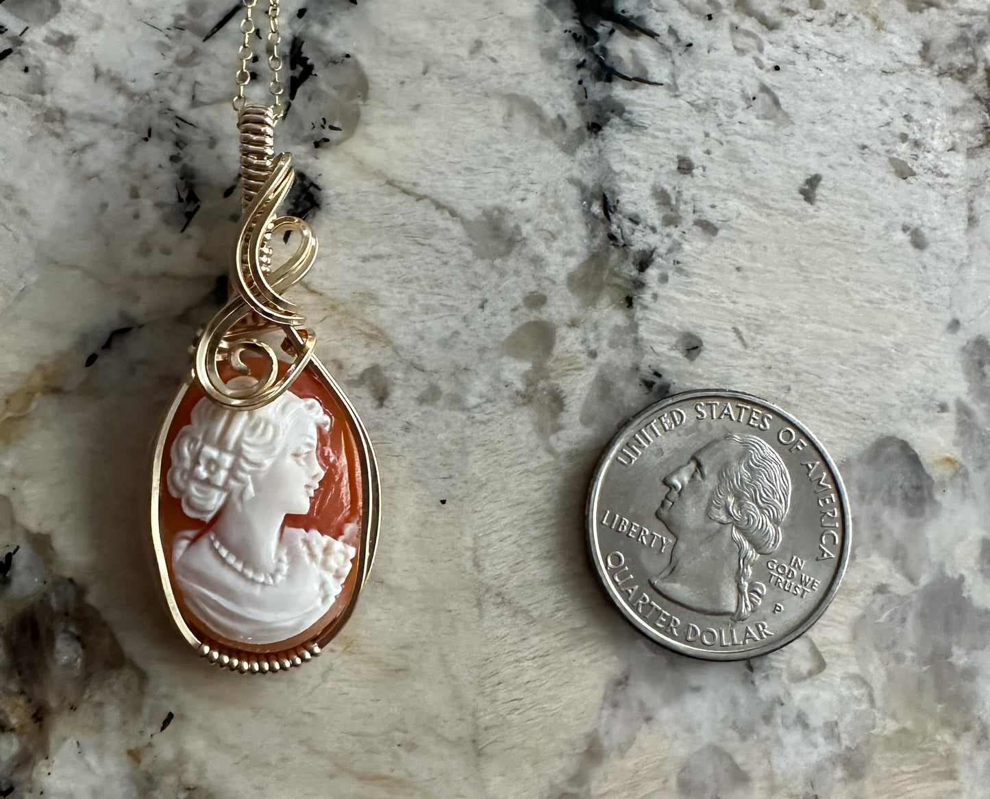 Wire wrapped 14k goldfilled wire pendant of a handcarved shell vintage cameo of a woman with a pearl necklace and flowers