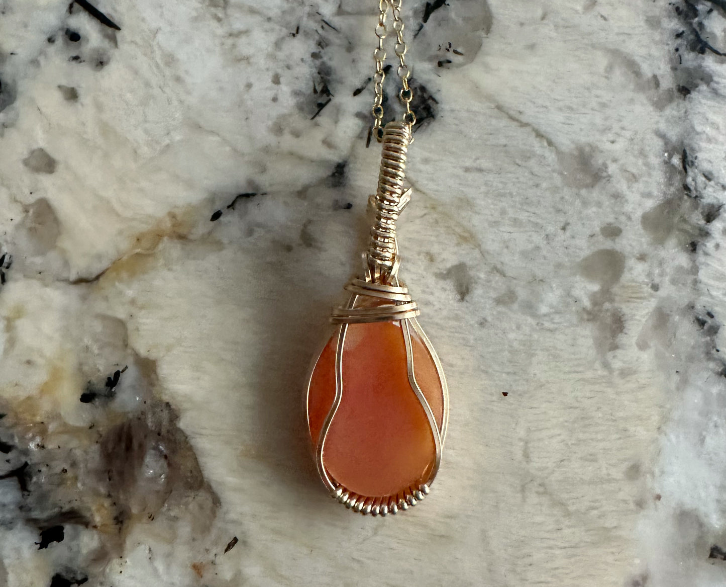 Wire wrapped 14k goldfilled wire pendant of a handcarved shell vintage cameo of a woman with a pearl necklace and flowers