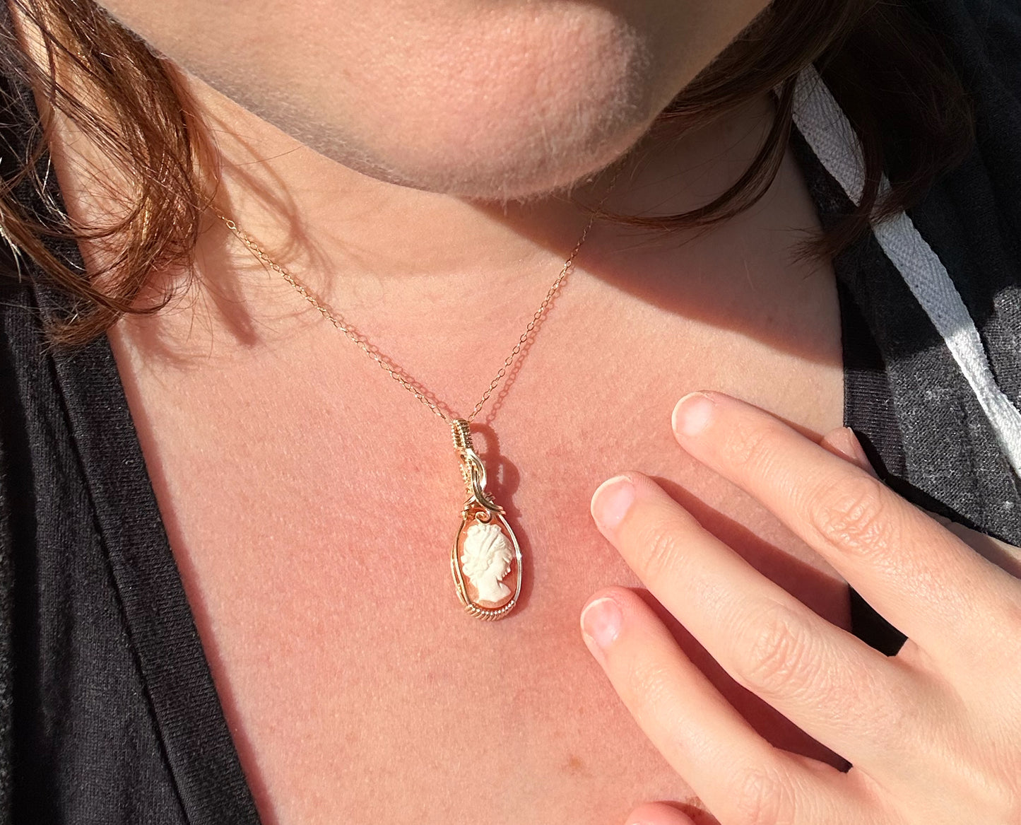 Wire wrapped 14k goldfilled wire pendant of a handcarved shell vintage cameo of a woman with a pearl necklace and flowers