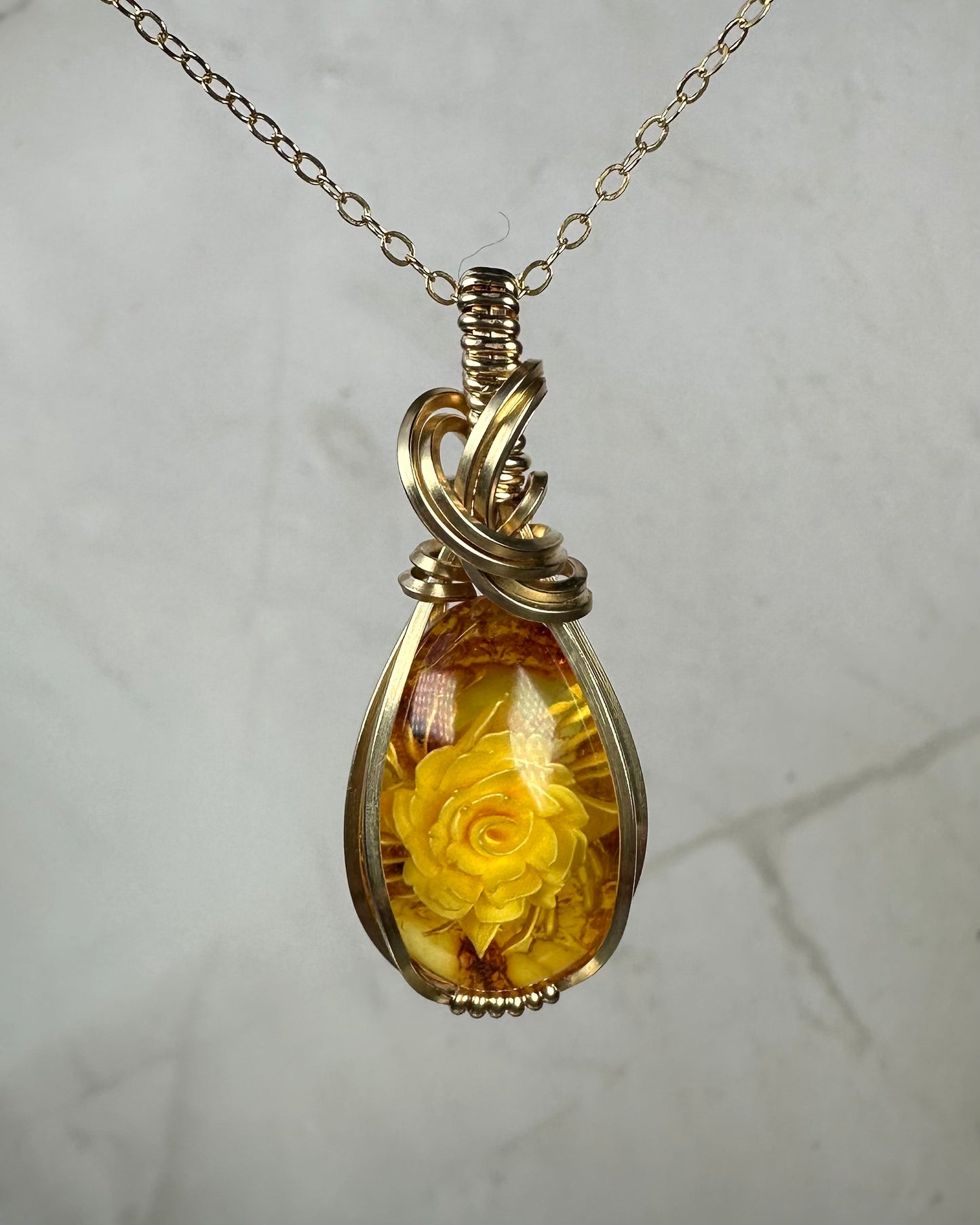Carved Intaglio Baltic Amber with a Rose Pendant Wire-Wrapped in 14k Goldfill