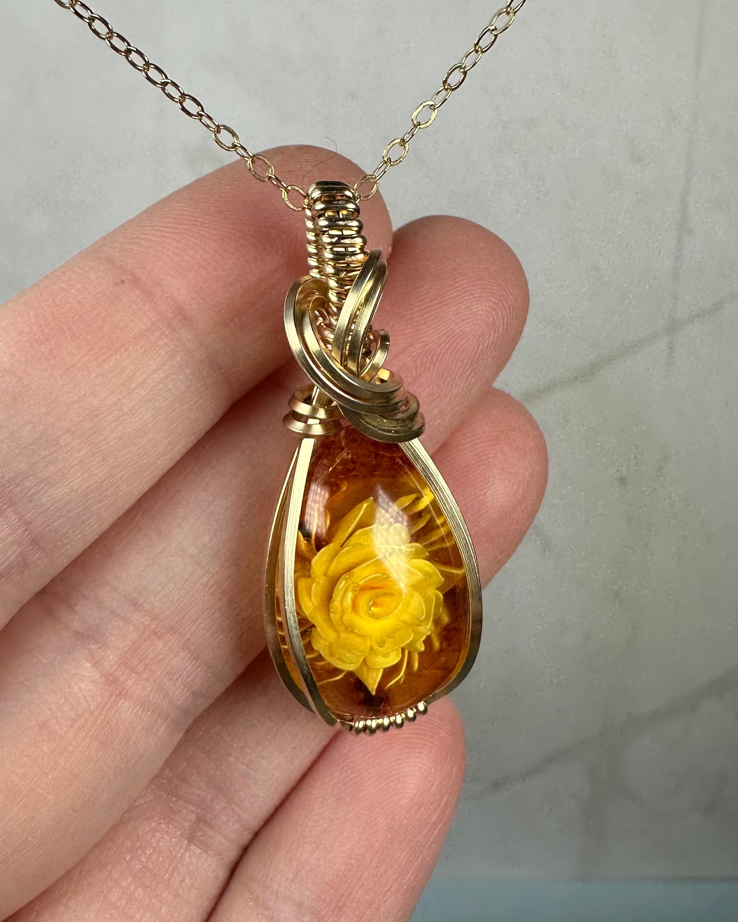 Carved Intaglio Baltic Amber with a Rose Pendant Wire-Wrapped in 14k Goldfill