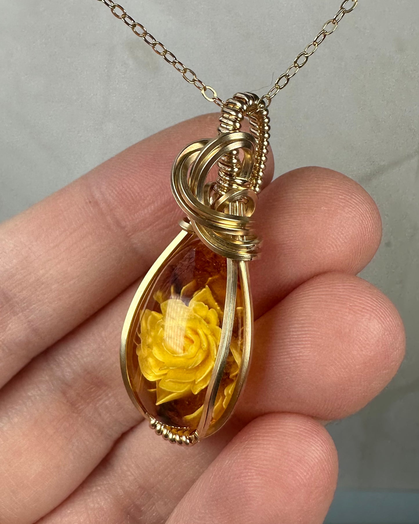 Carved Intaglio Baltic Amber with a Rose Pendant Wire-Wrapped in 14k Goldfill