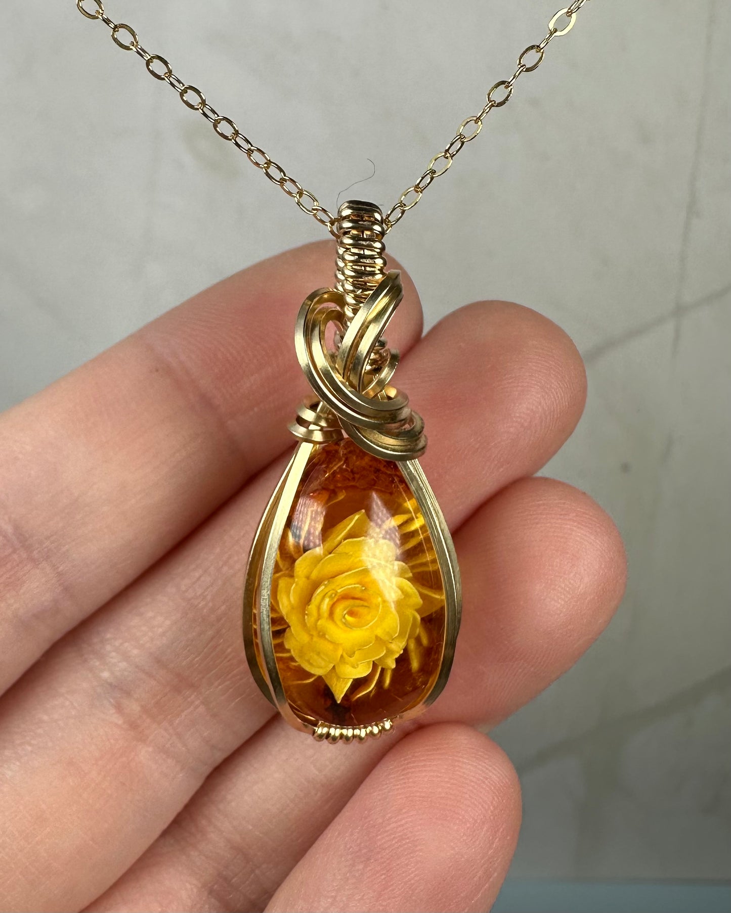 Carved Intaglio Baltic Amber with a Rose Pendant Wire-Wrapped in 14k Goldfill