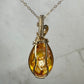 Carved Intaglio Baltic Amber with a Rose Pendant Wire-Wrapped in 14k Goldfill