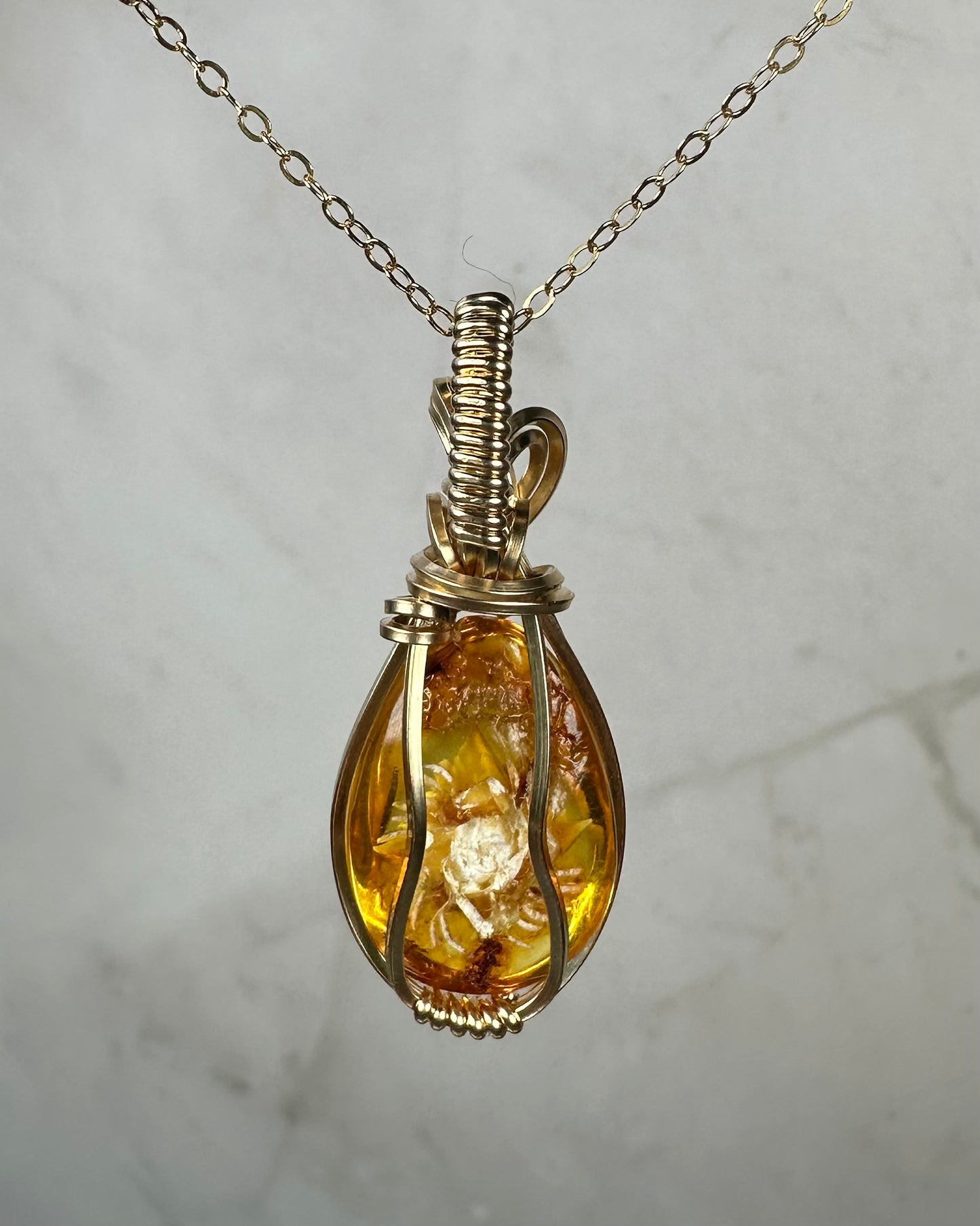 Carved Intaglio Baltic Amber with a Rose Pendant Wire-Wrapped in 14k Goldfill