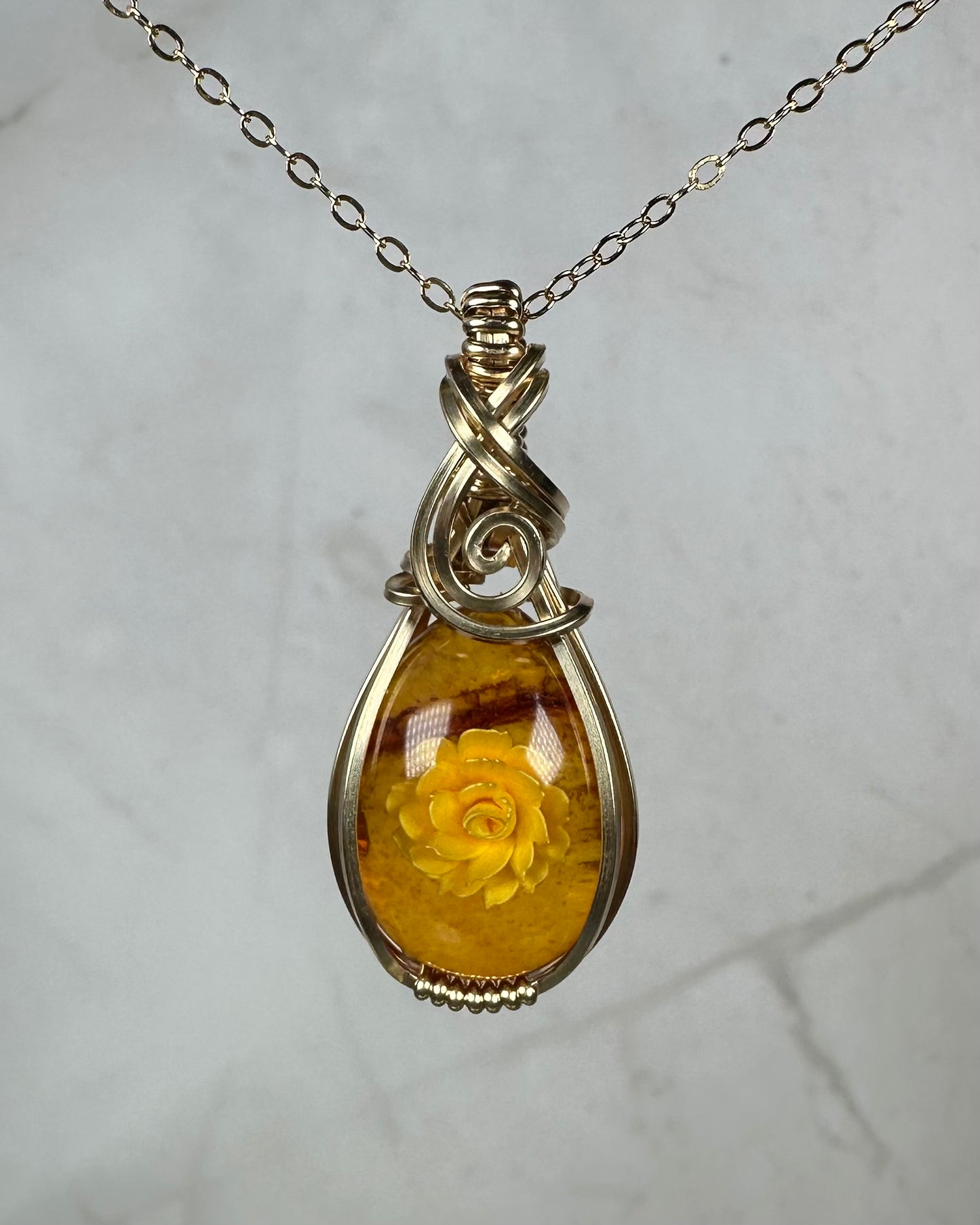 Carved Intaglio Baltic Amber with a Rose Pendant Wire-Wrapped in 14k Goldfill