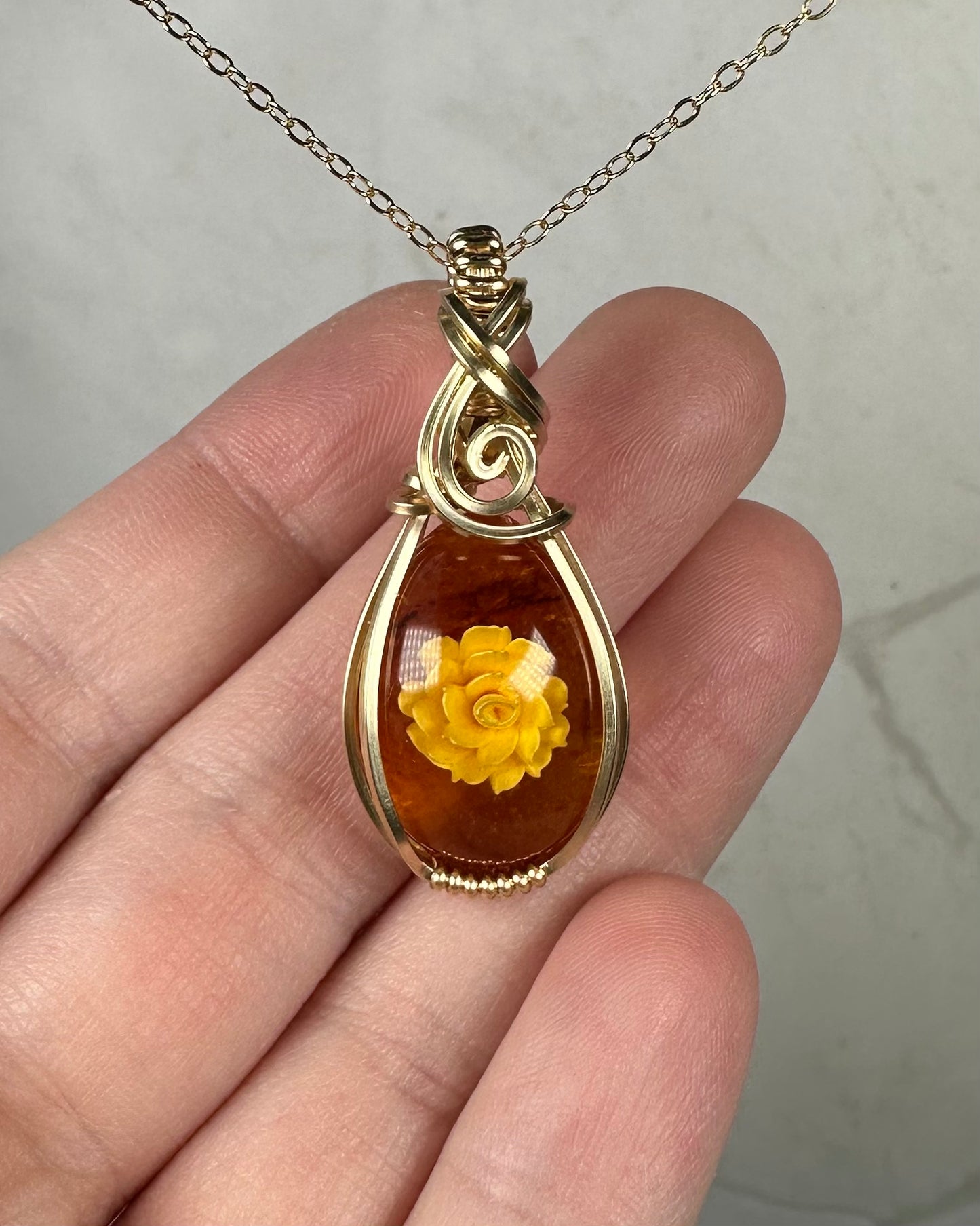 Carved Intaglio Baltic Amber with a Rose Pendant Wire-Wrapped in 14k Goldfill