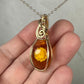 Carved Intaglio Baltic Amber with a Rose Pendant Wire-Wrapped in 14k Goldfill