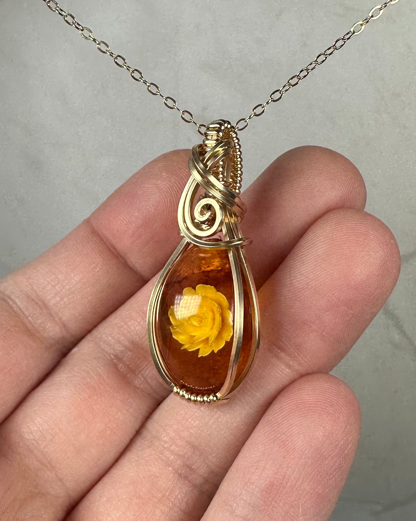 Carved Intaglio Baltic Amber with a Rose Pendant Wire-Wrapped in 14k Goldfill