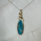 Wire-Wrapped Ithaca Peak Turquoise with Pyrite Pendant in 14k Goldfill