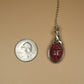 Carved Rhodochrosite Scarab Pendant Wire-Wrapped in Sterling Silver